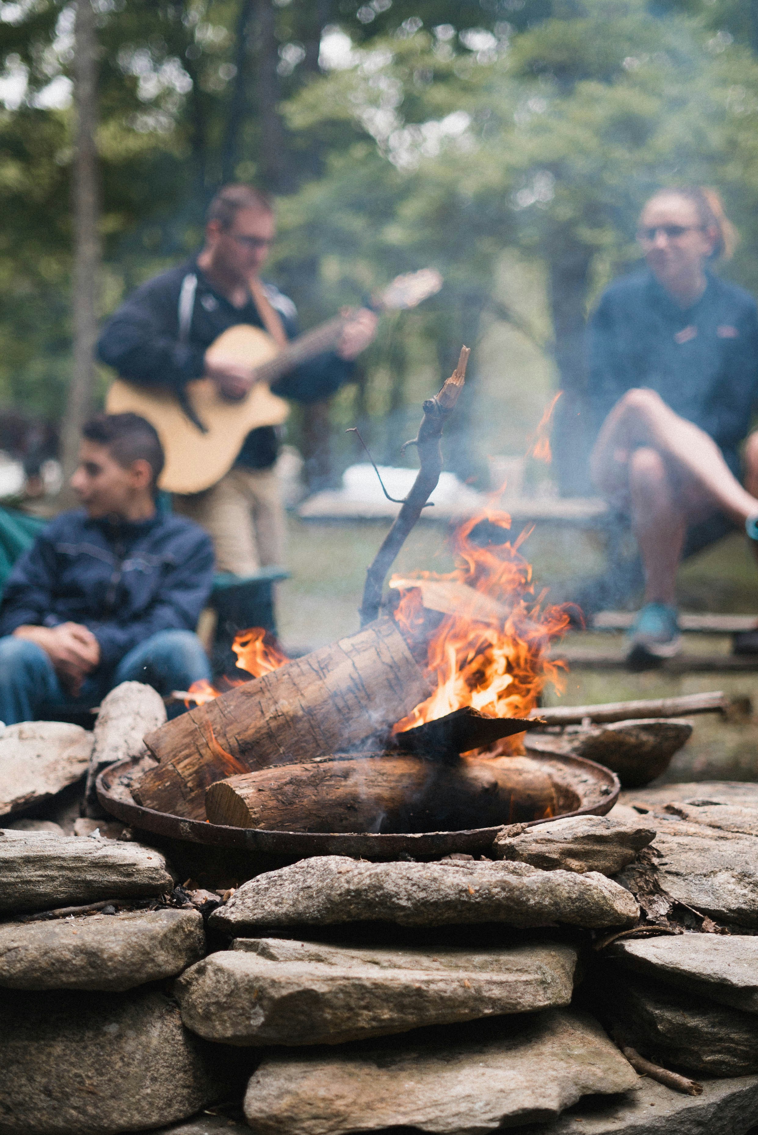 Family around a bonfire.